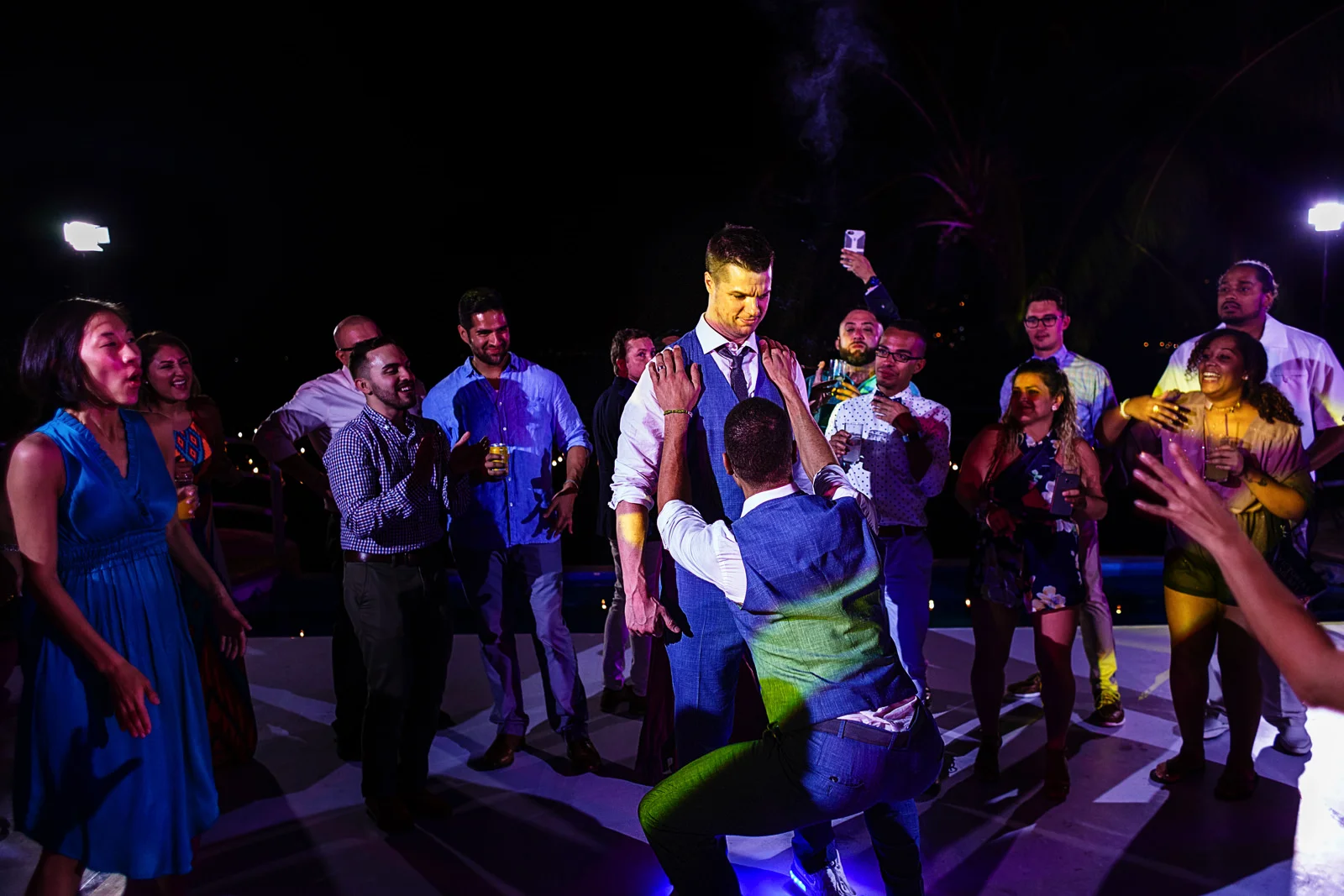 Grooms dancing with guest at the dancefloor in La Mansion Vallarta villa