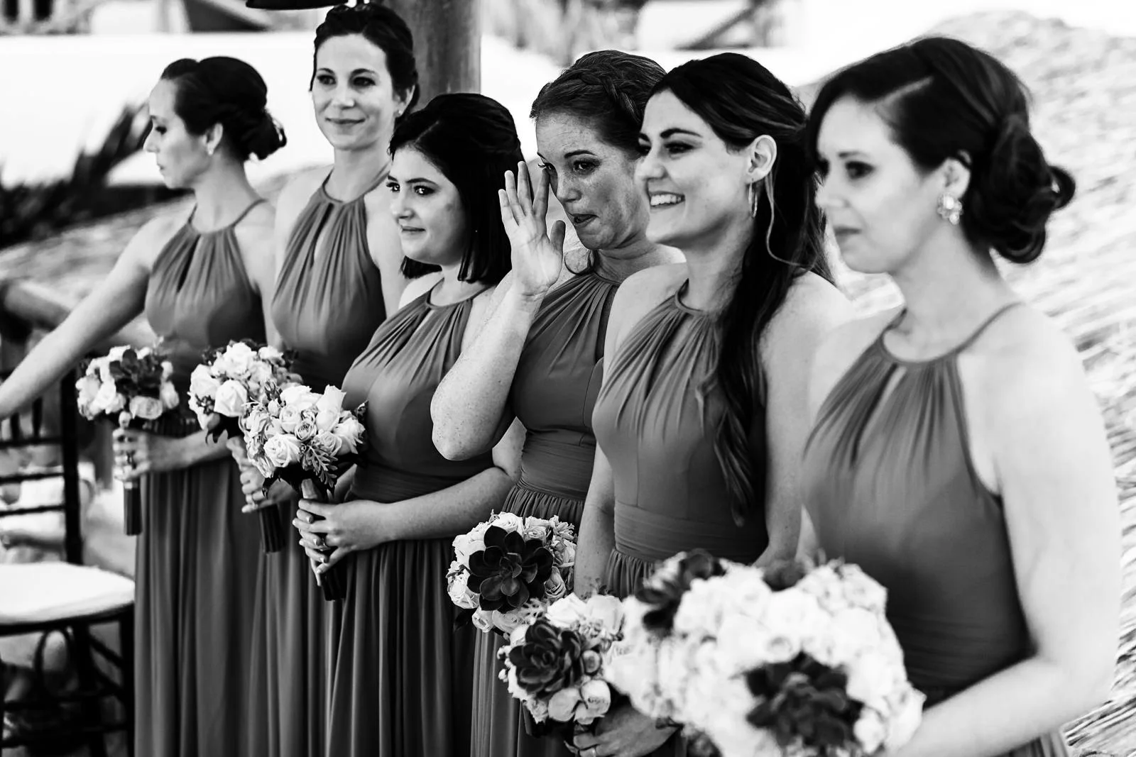 Bridesmaids reacting to the wedding ceremony