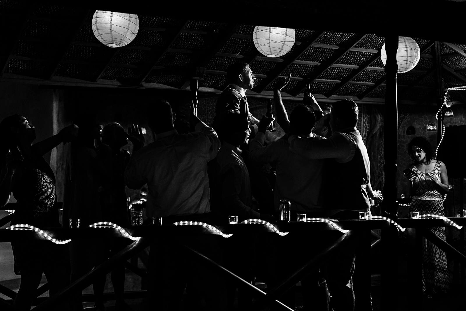 Groom being raised in the air right at the dance floor