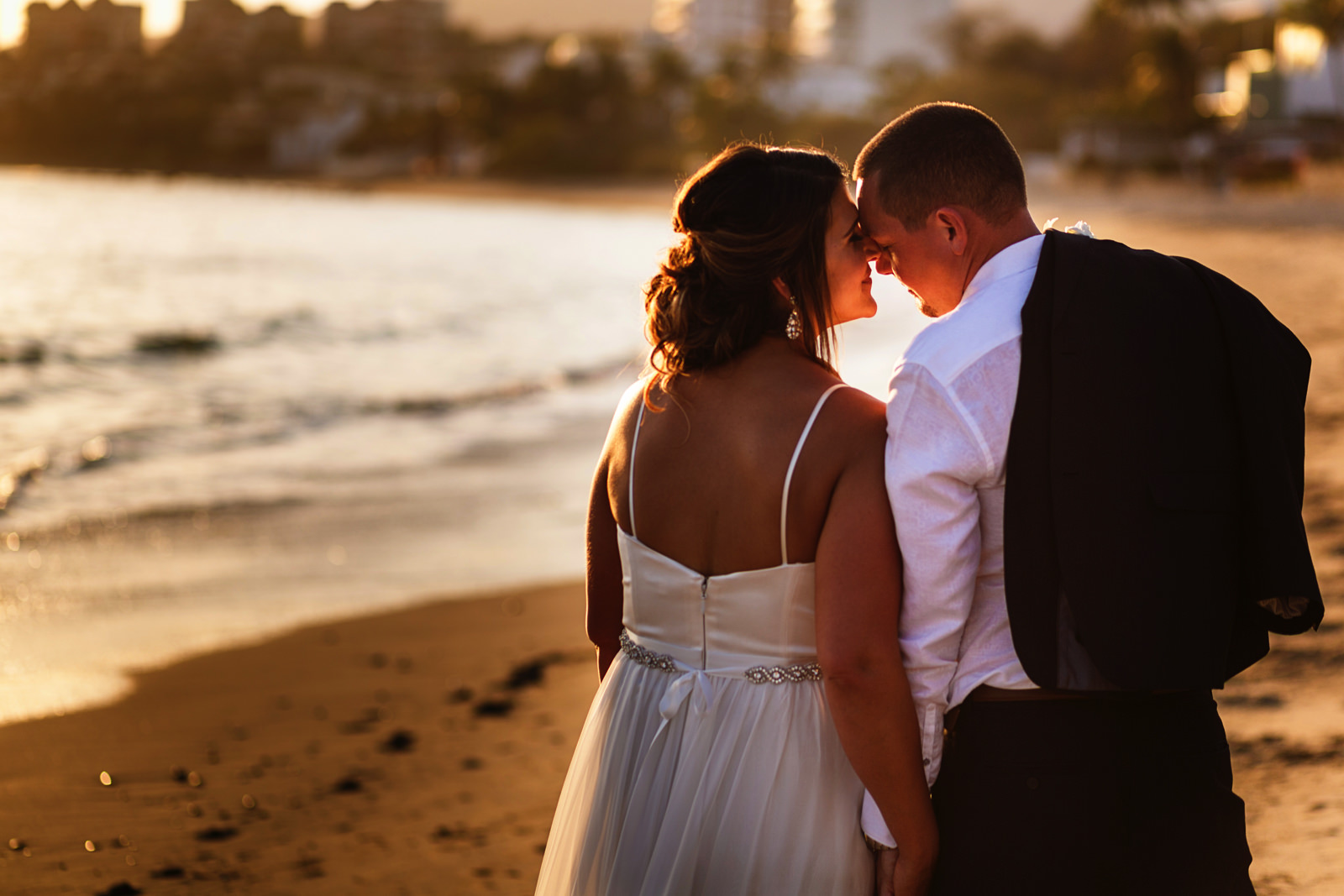 Bride and groom portrait with backlight from the sun