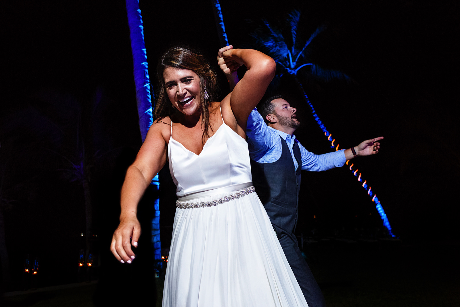 Bride and wedding guest dancing and having fun