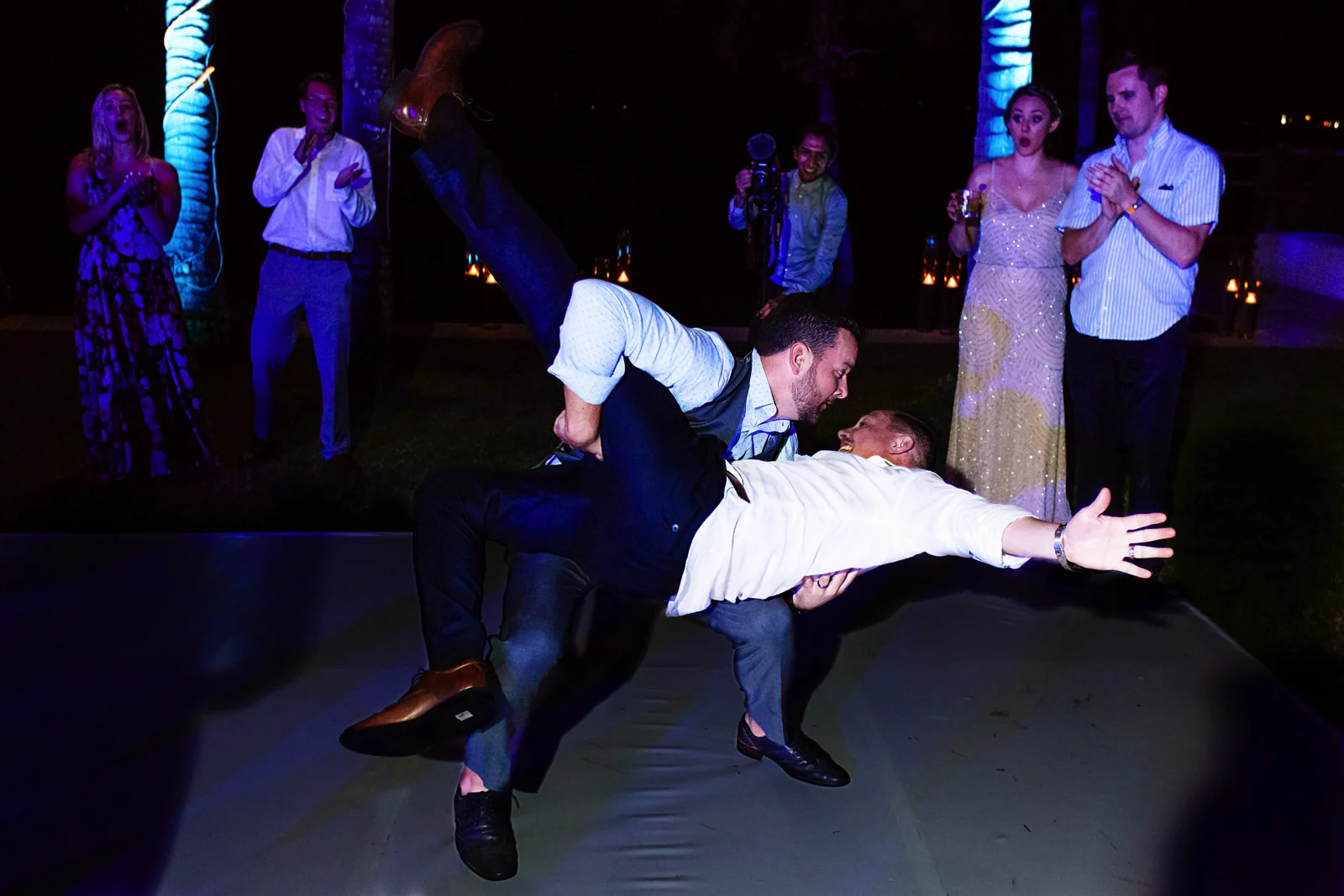 wedding guest carry the groom in the middle of the dance floor