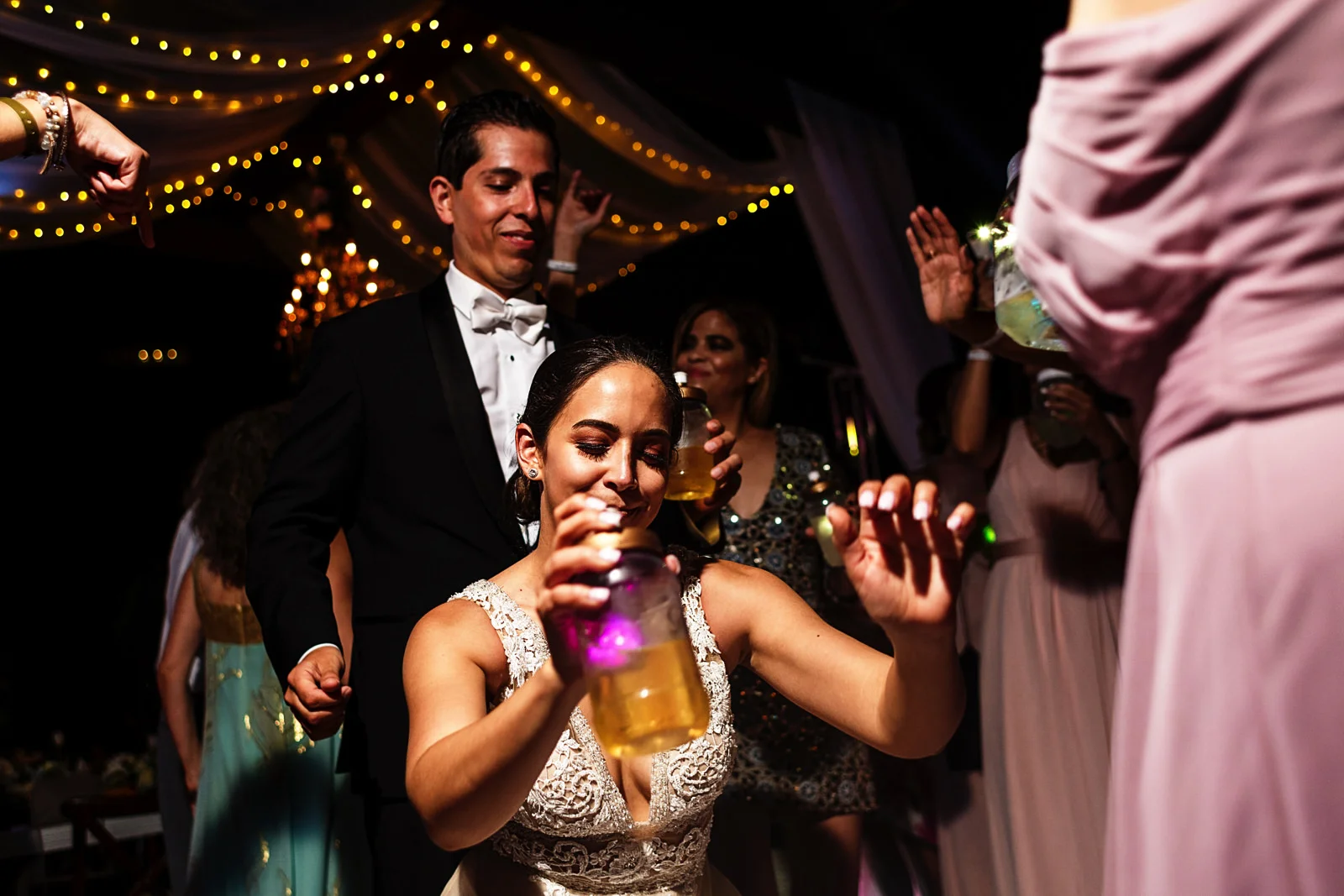 Bride going down dancing in front of the groom