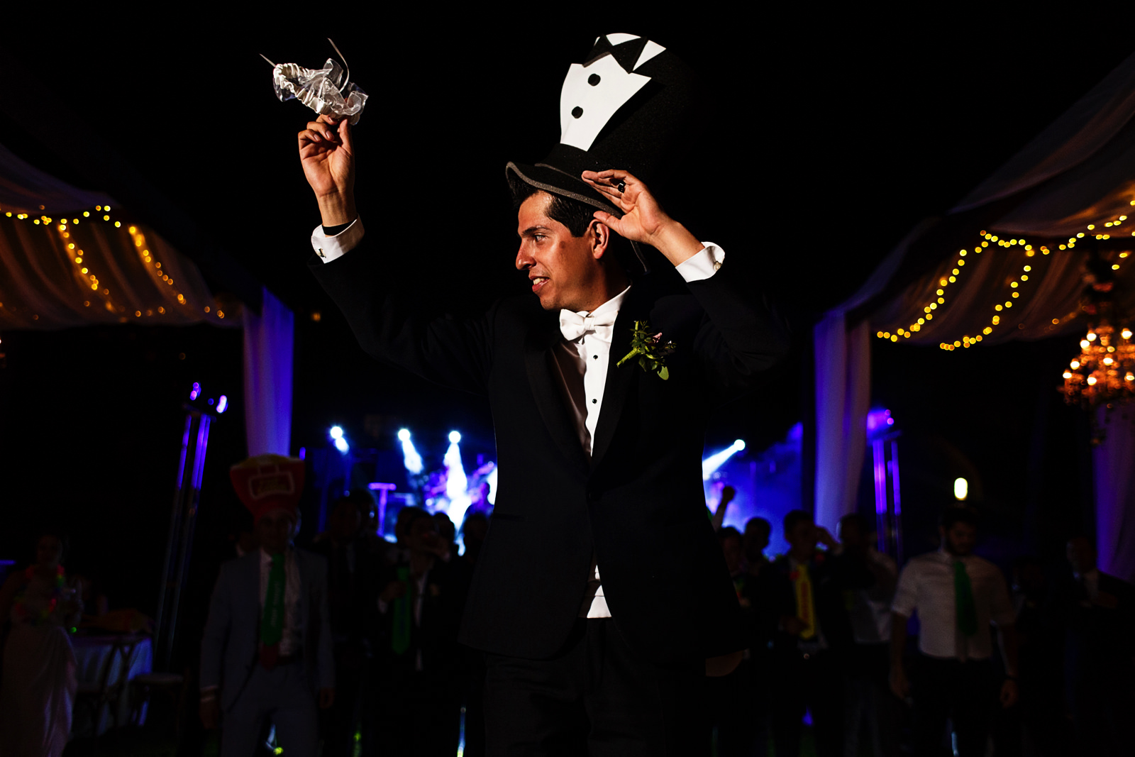 Groom about to throw the garther