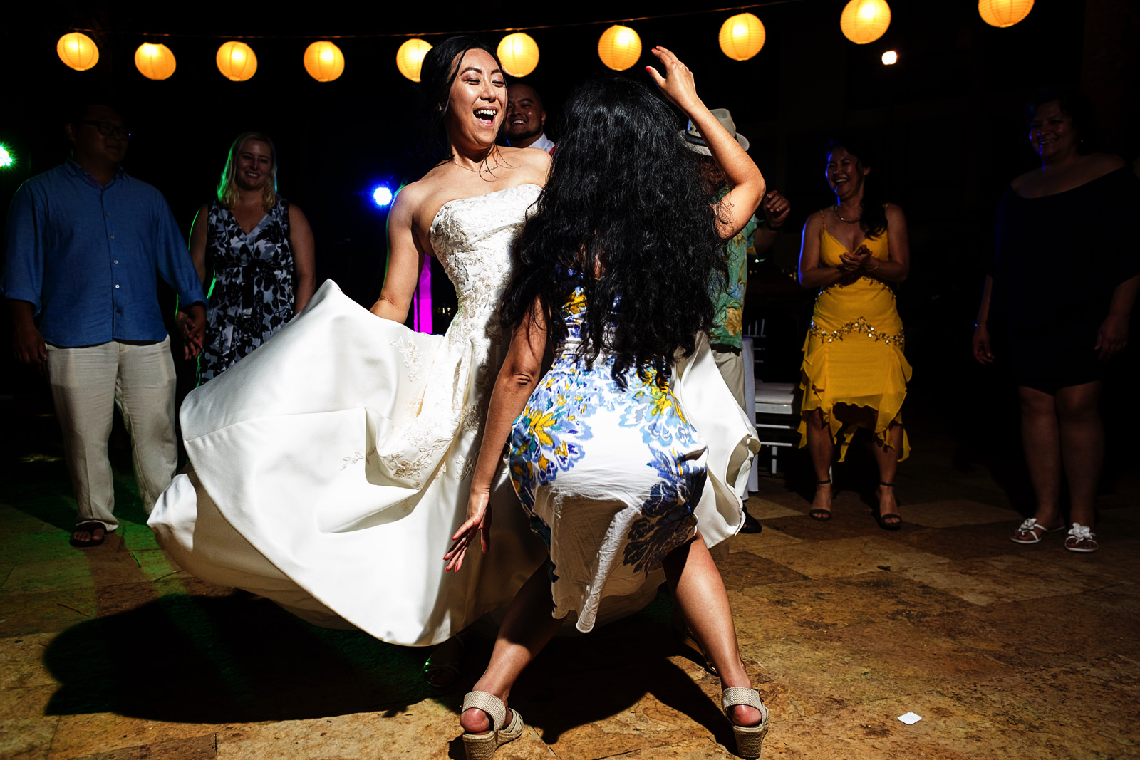 Bride dancing with a wedding guest