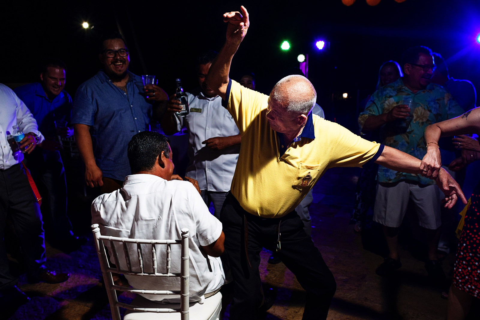 Father of the bride trying to do a lap dance as he is being controlled by his wife