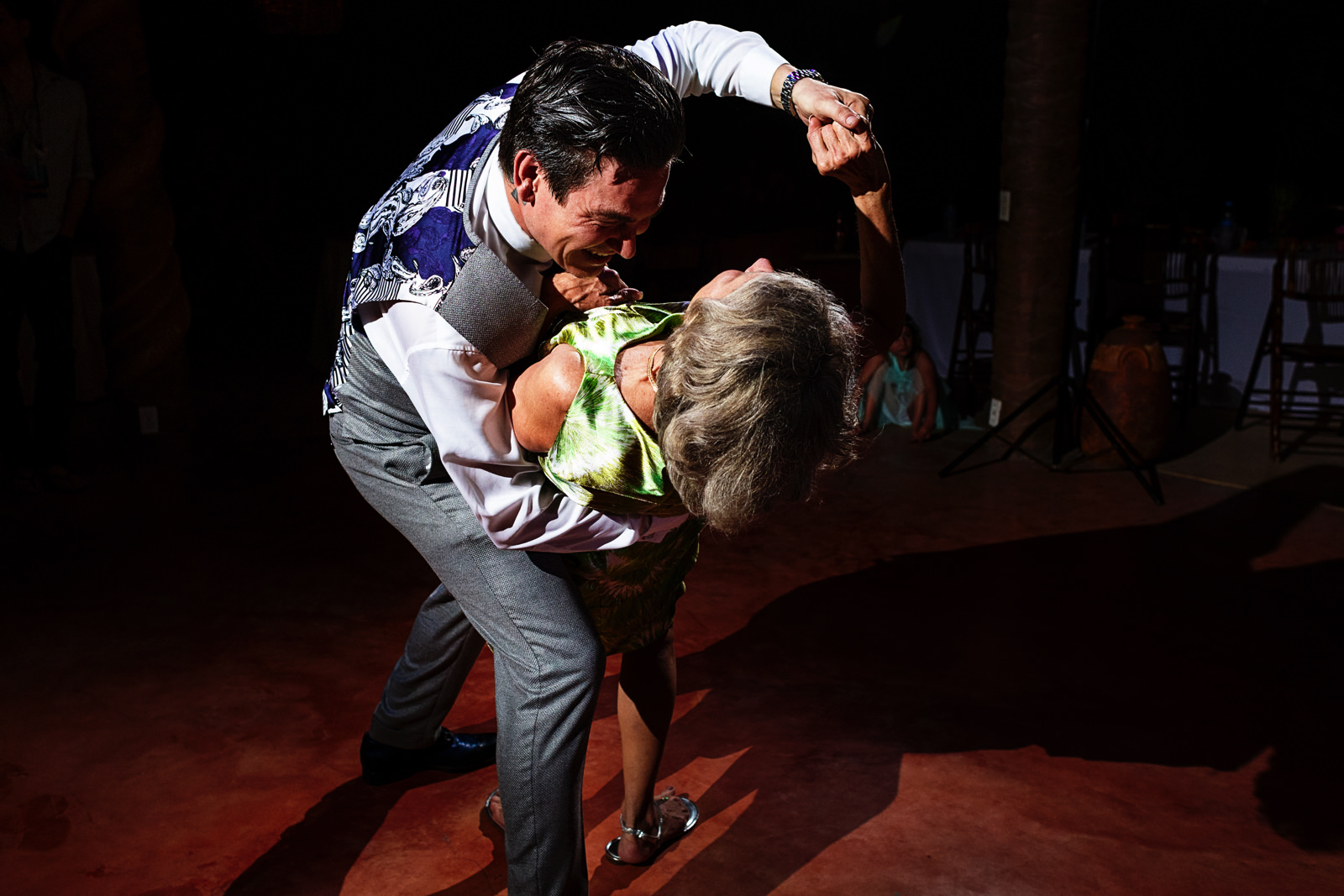 Groom leans his mother at the end of their dance as mother and son