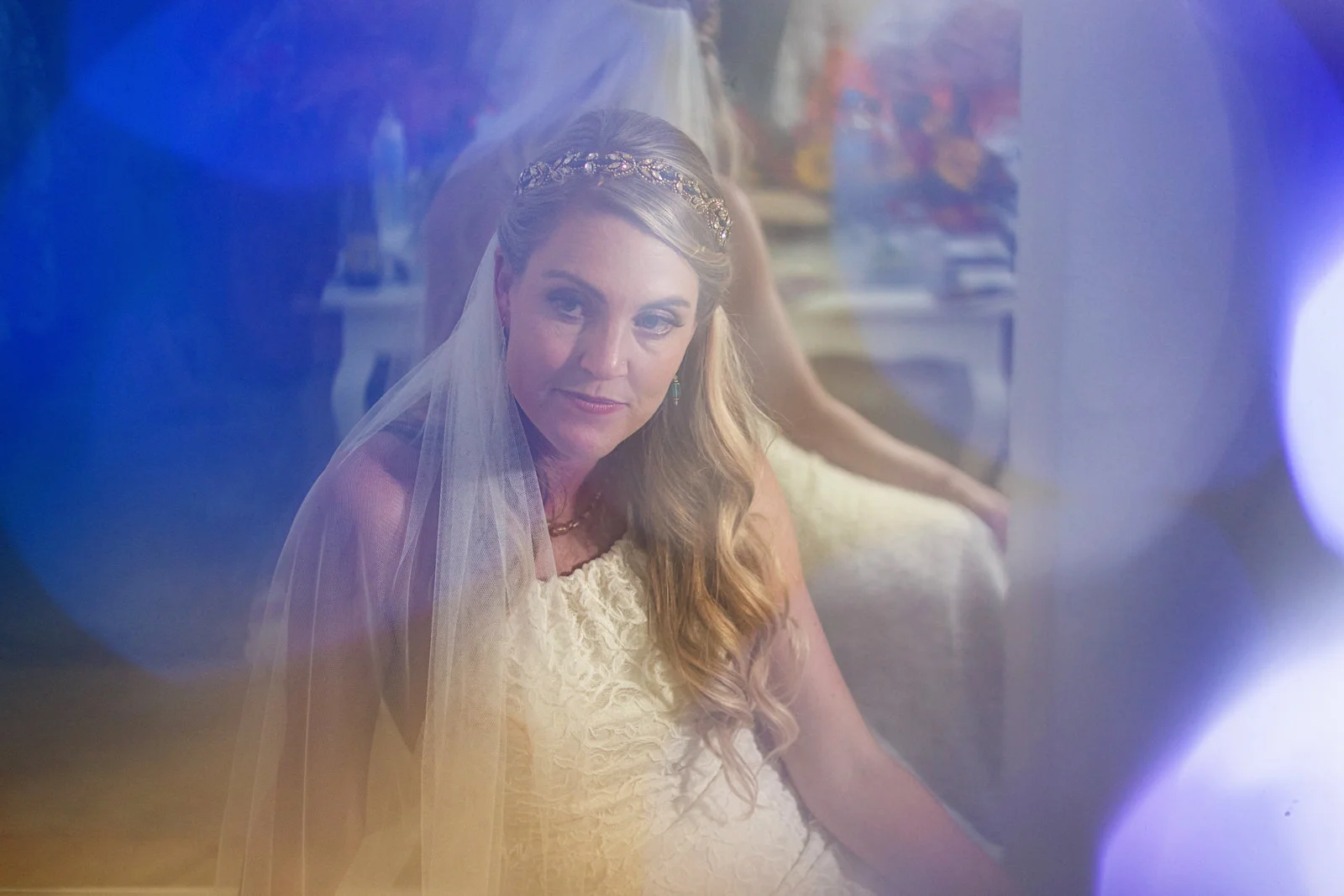 Bride’s portrait through colored lens flare