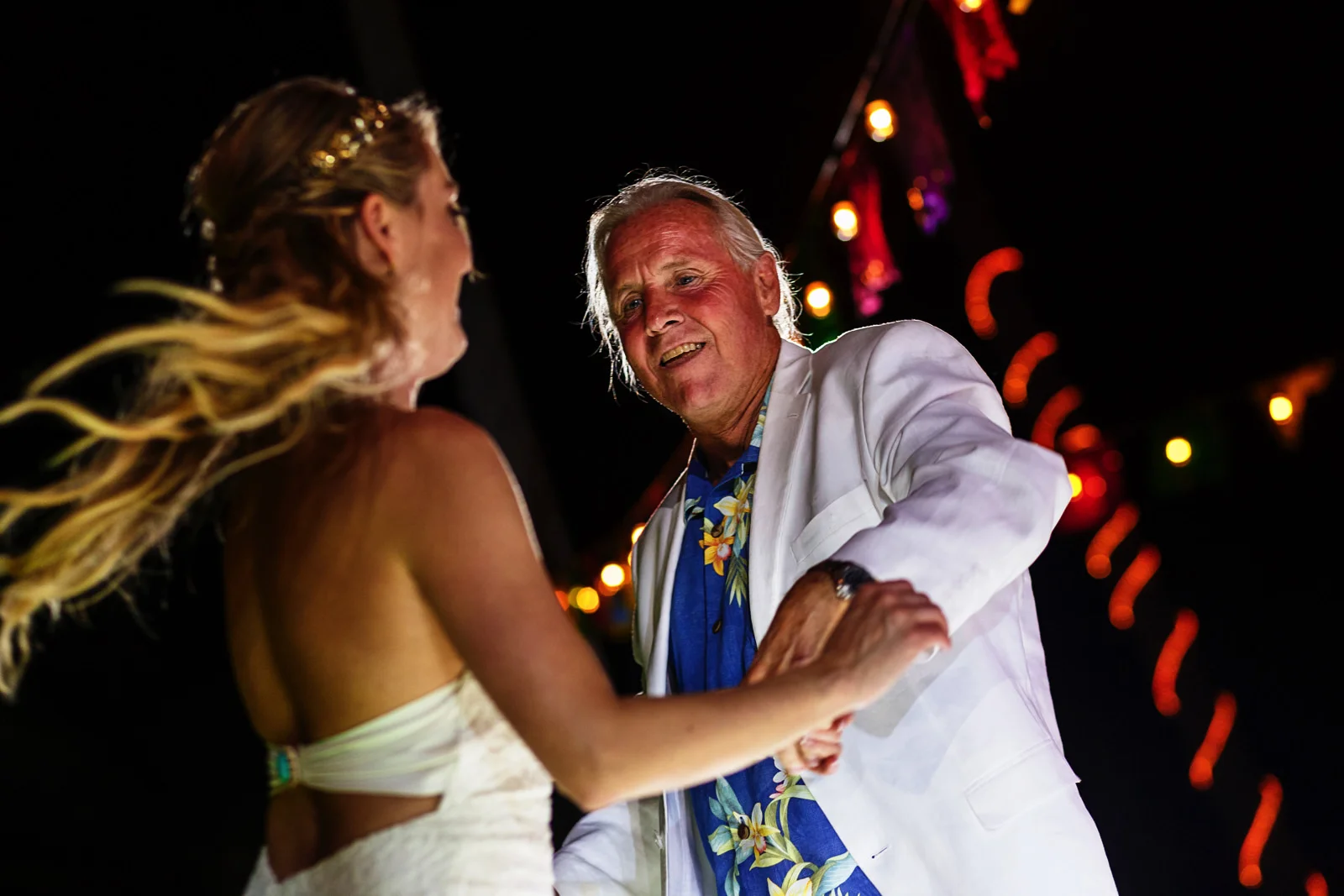 Father spins the bride during the dad and daughter dance