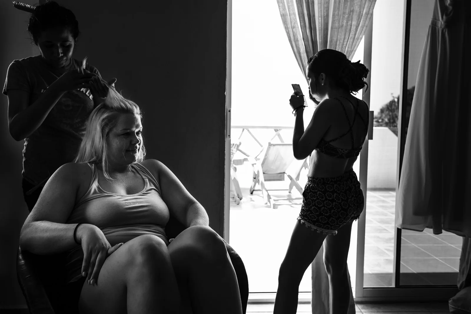 Bride being hairstyled next to her daughter-in-law by the window on the bridal suite at Miramar Yelapa.