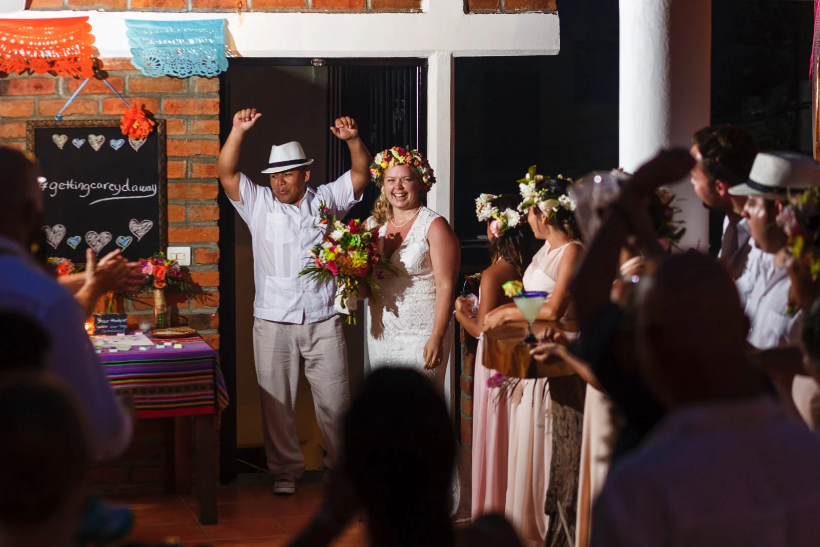 Bride and groom entrance into the reception at Miramar terrace among all of the friends, family and wedding guests.