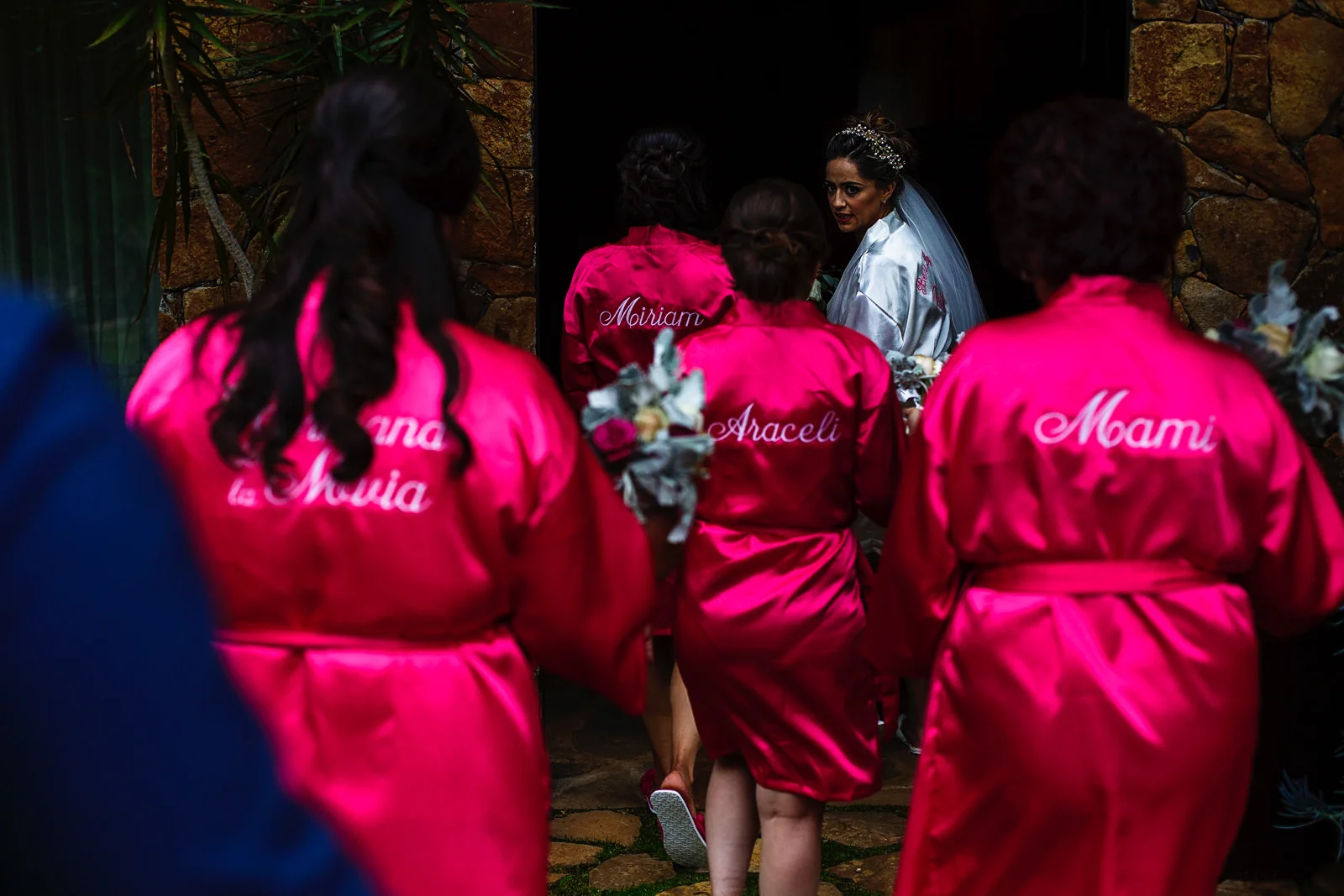 Bride and bridesmaids going back to the room after their outdoor portraits.