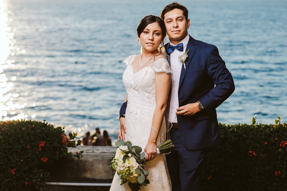 Bride and groom with the ocean in the background