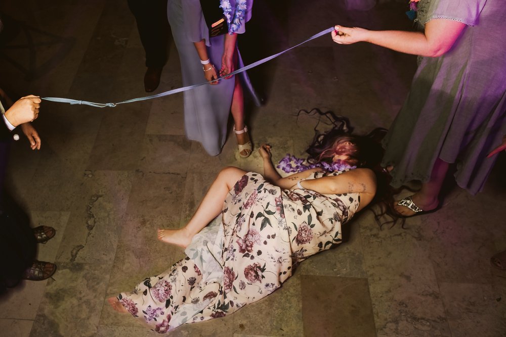 Wedding guest falls after attempting to pass below the limbo