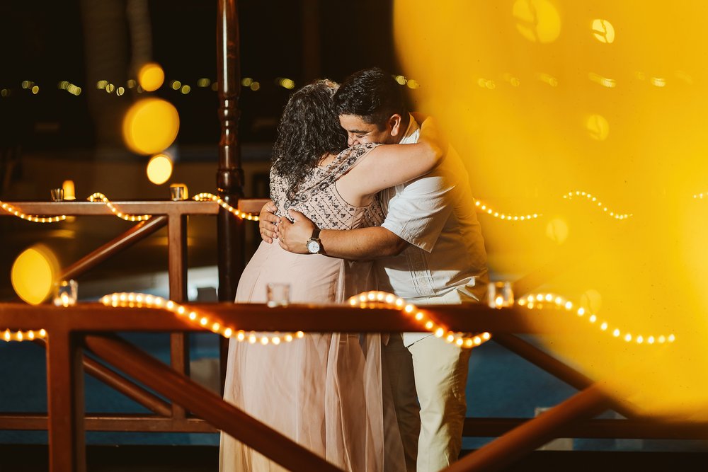 Groom and mother hug during their dance at the wedding reception