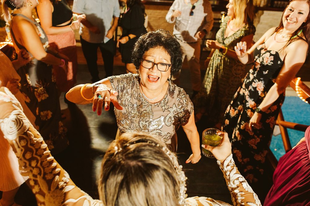 Mother of the bride going crazy with the bride at the dance floor