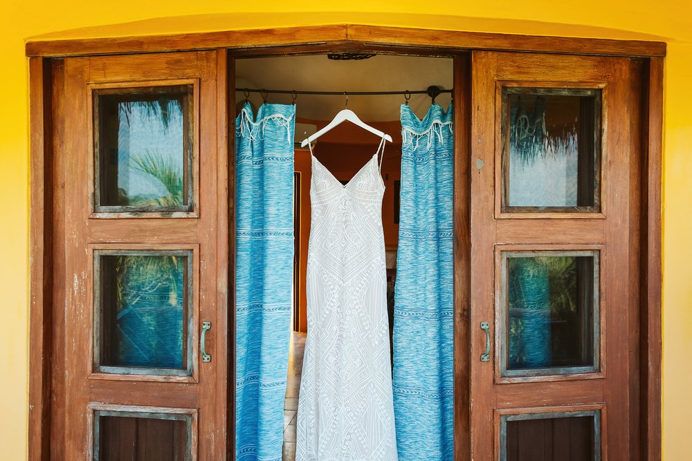 Wedding dress hanging at the bridal suite window at Villas Rana Verde, Sayulita