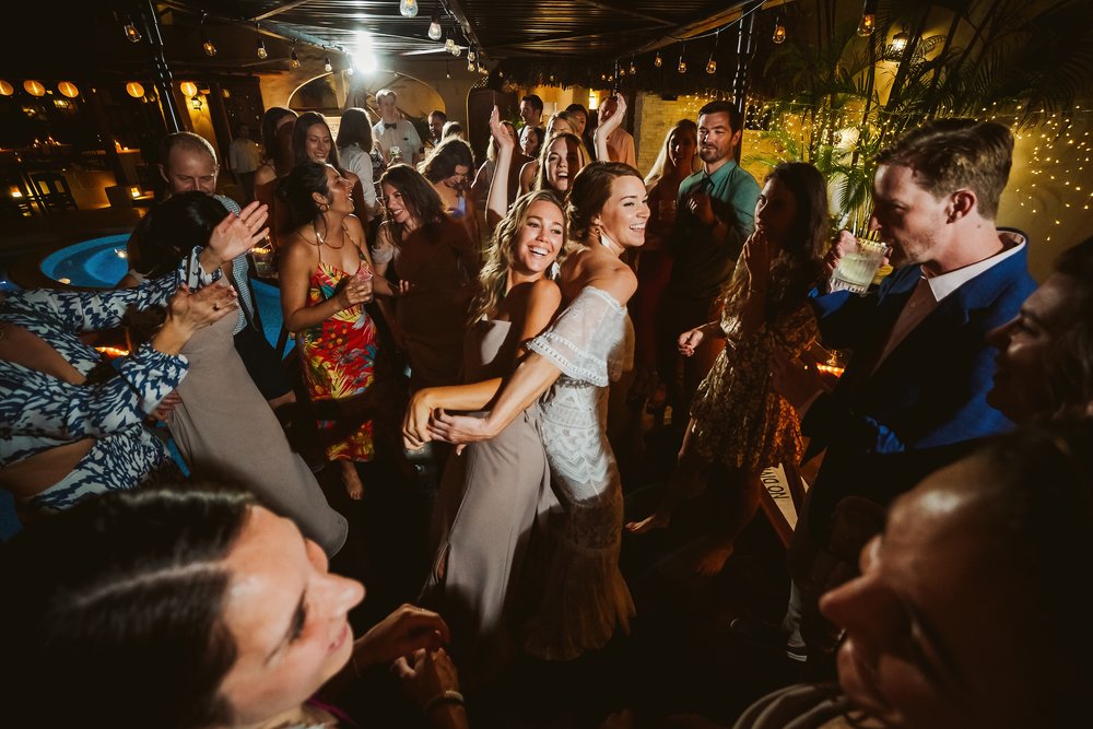 Dance floor full with bride, groom and guests at the wedding party in Hotel Playa Fiesta