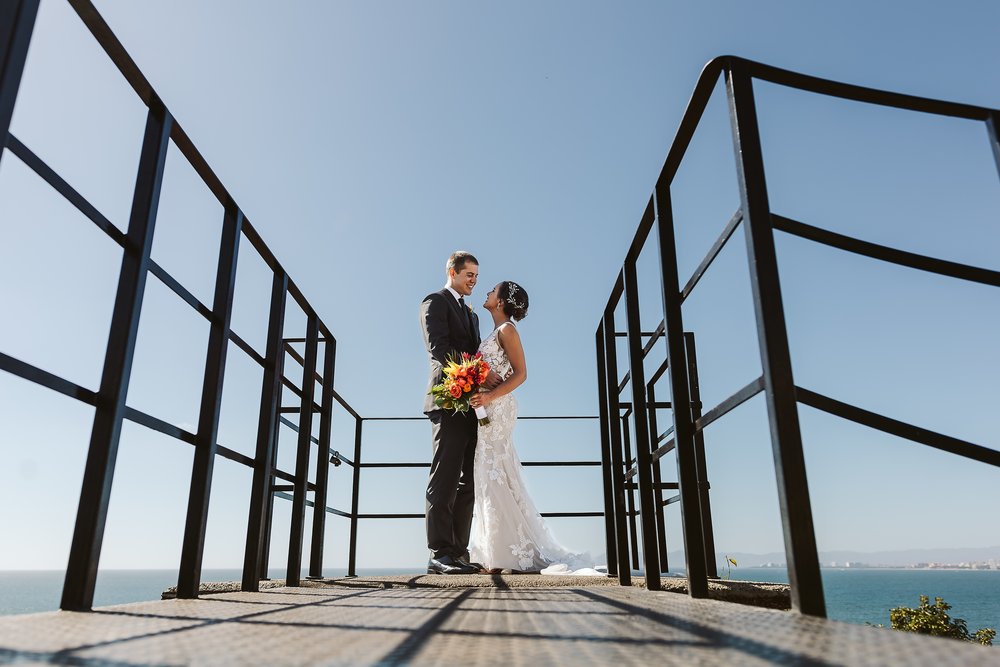 Bride and groom portrait on top of the old lighthouse in downtown Puerto Vallarta