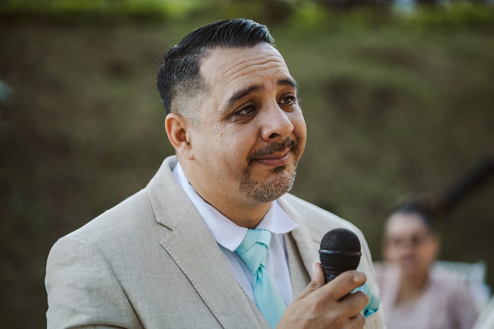 Groom tearing up during his wedding ceremony vows