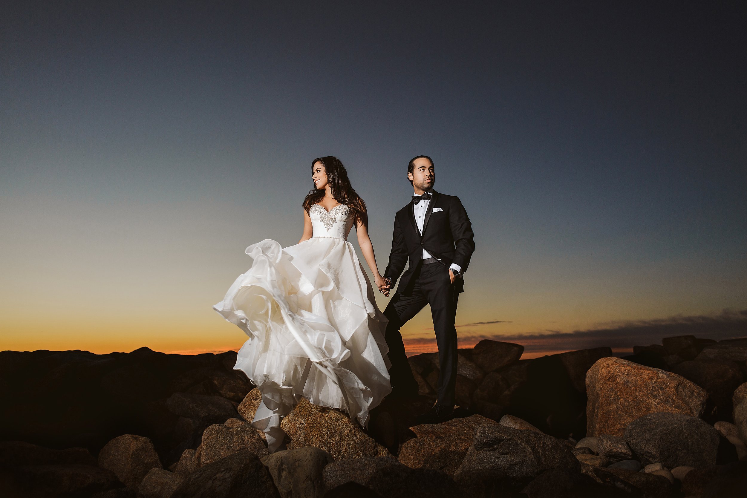 wedding-bride-groom-puerto-vallarta-sunset-power-couple-standing-rocks.JPG