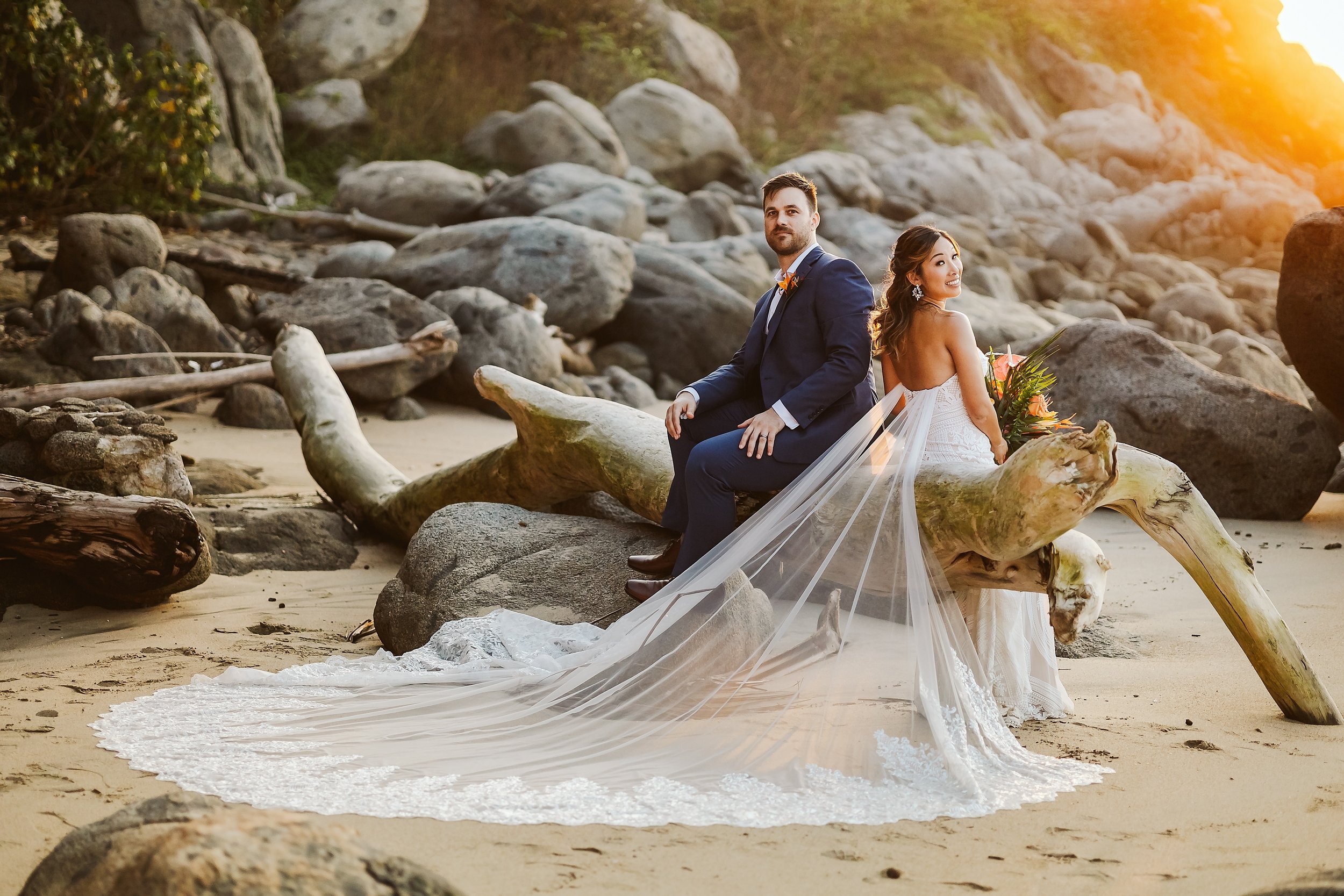wedding-rancho-huracan-sayulita-sunset-beach-bride-groom-sitting-log.JPG