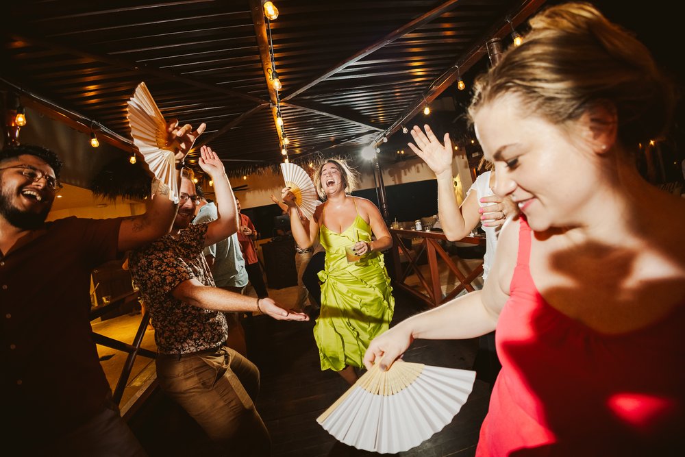 wedding-guests-dancing-fans-fun-laughter-dance-floor.JPG