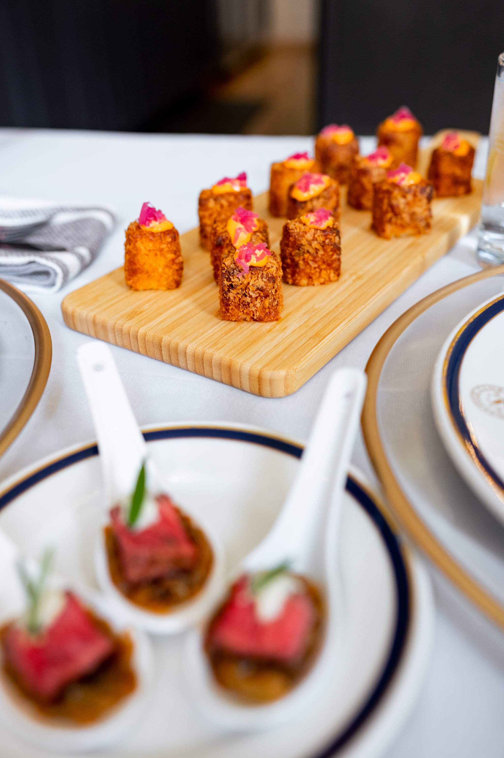 tablescape view of two different appetizers at the halifax club