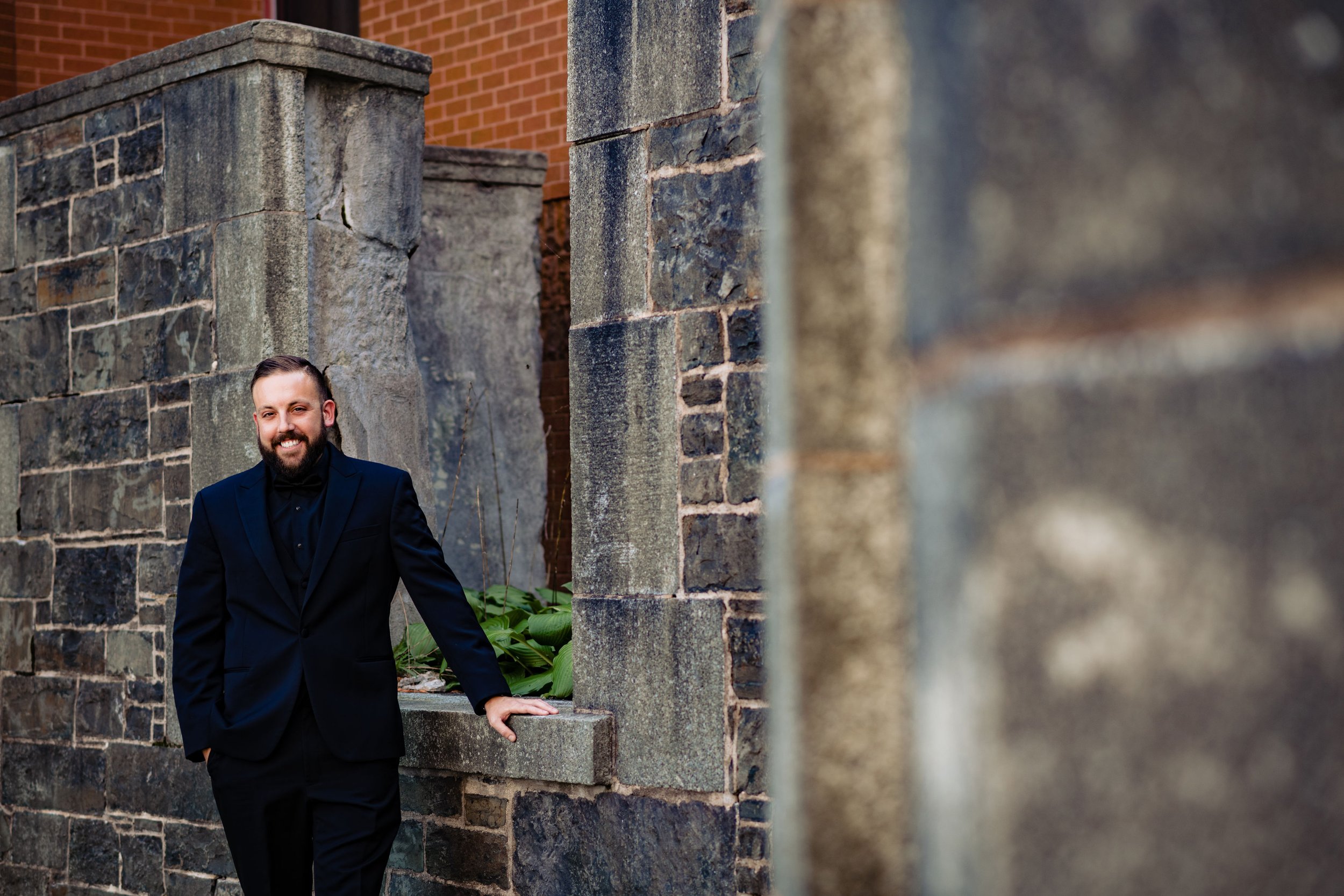 groom standing outside the juno tower in halifax