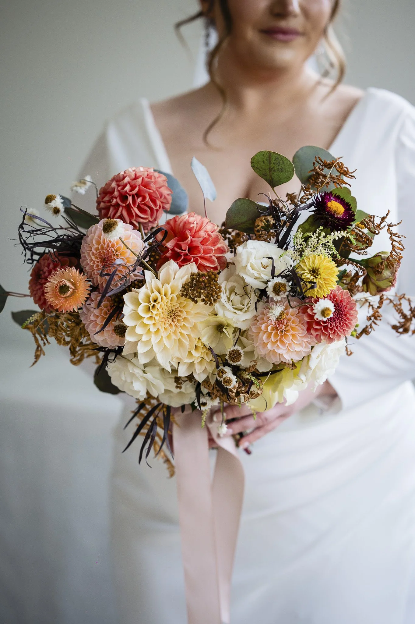  bride holding her flowers made by two birds one stone florist 