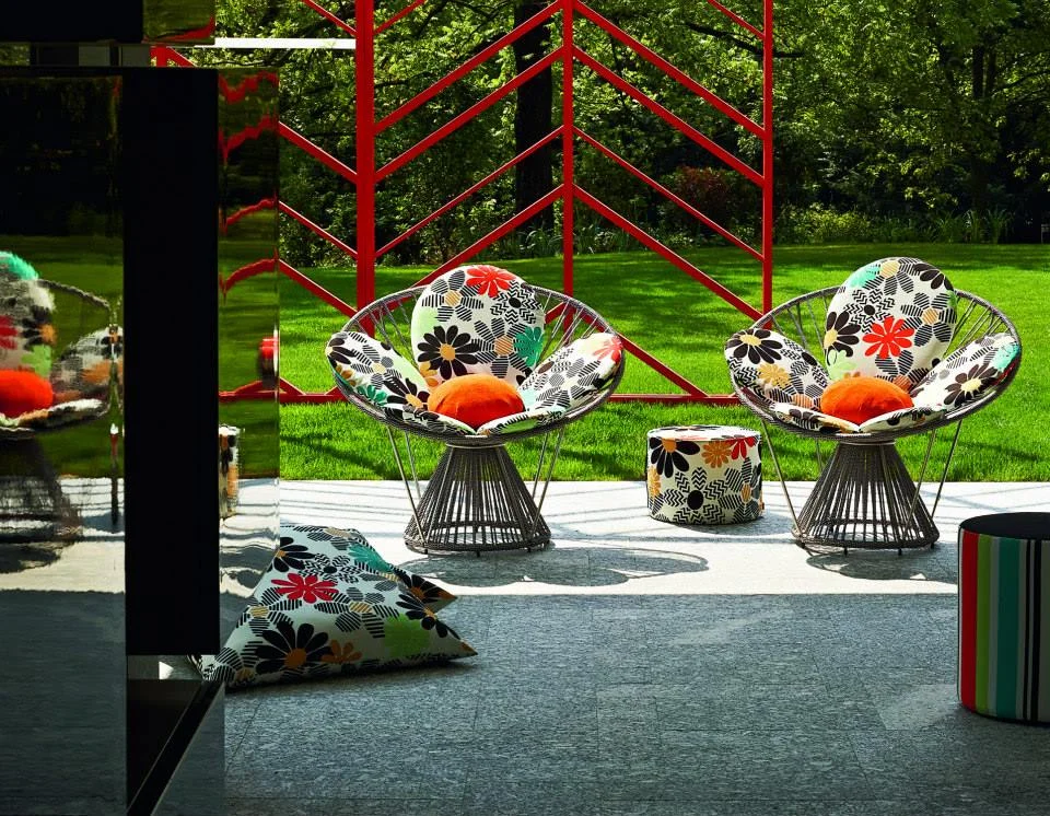 The "Cordula" chairs with Margherite Outdoor fabrics, cushions and poufs.