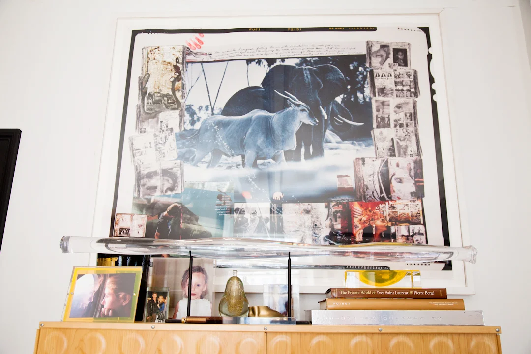 Another vignette of fantastically curated objects and art. On the wall there's a Peter Beard photograph. 