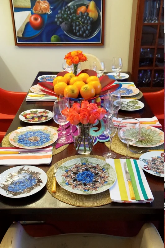A "favelization" example of my own: the plates designed by the Campana Brothers in collaboration with Bernardaud displaying a collage of some of the brothers' most popular designs including the favela chair