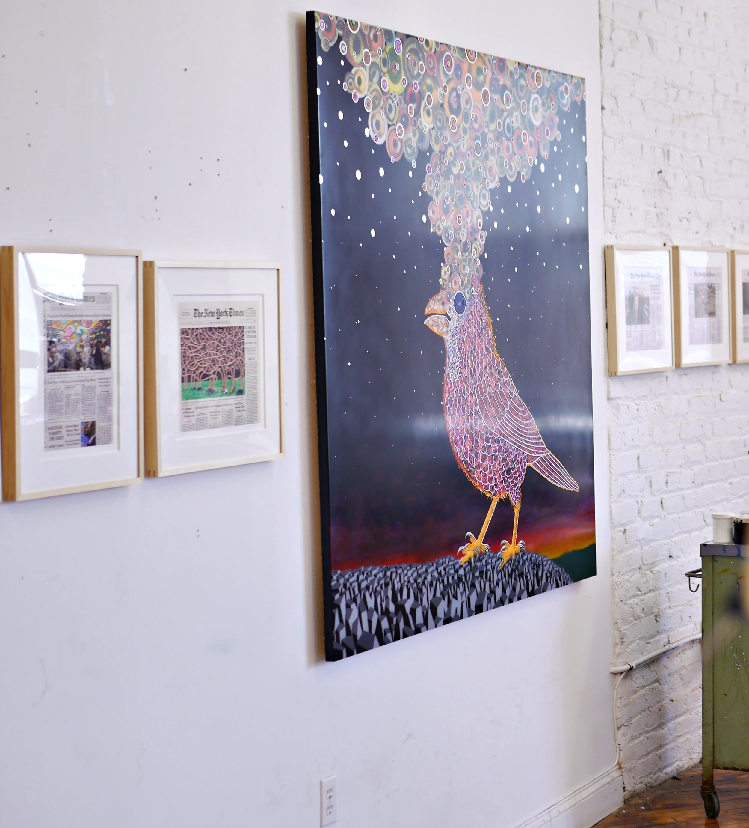 Some of the New York Times "collaborations" flank a large painting that also will be at the show.