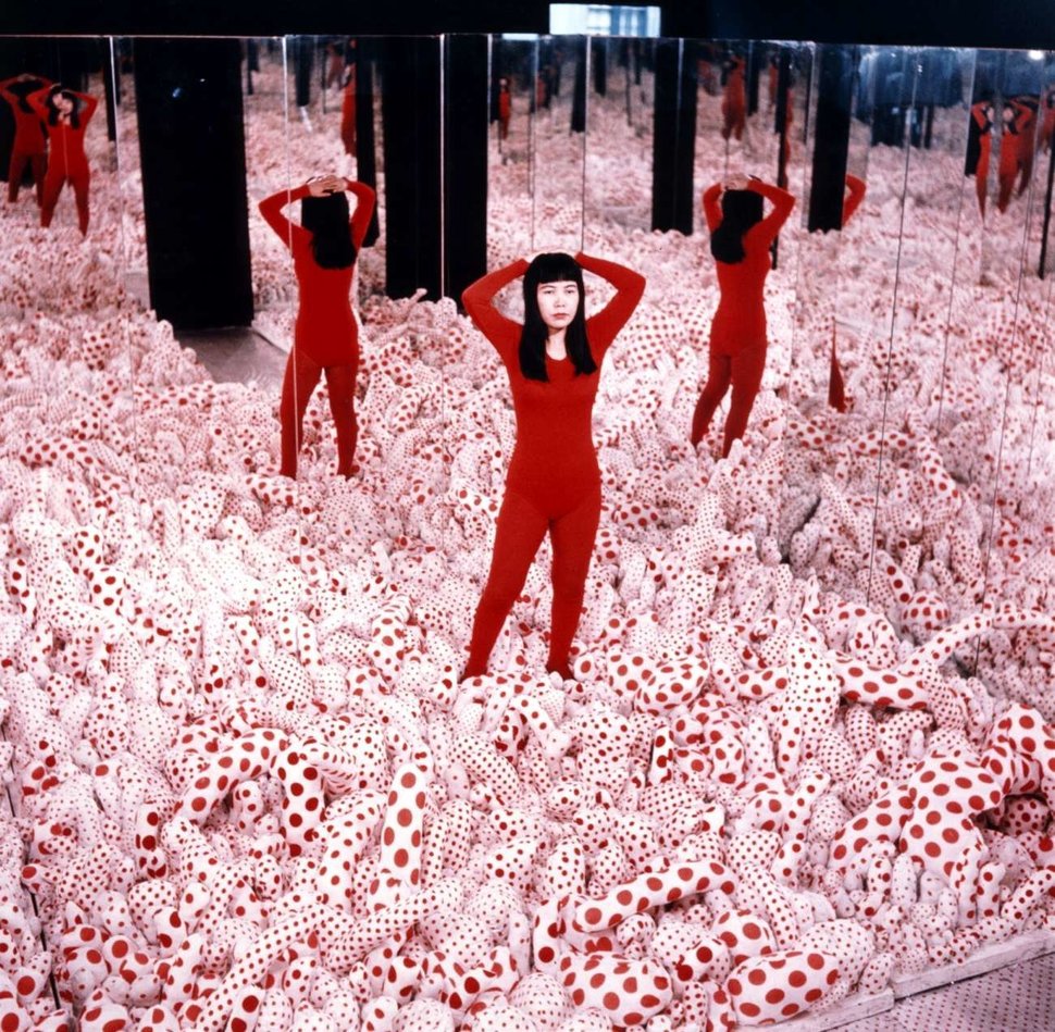 Yayoi Kusama in her 1965 "Phalli’s Field" room at Richard Castellane Gallery in New York