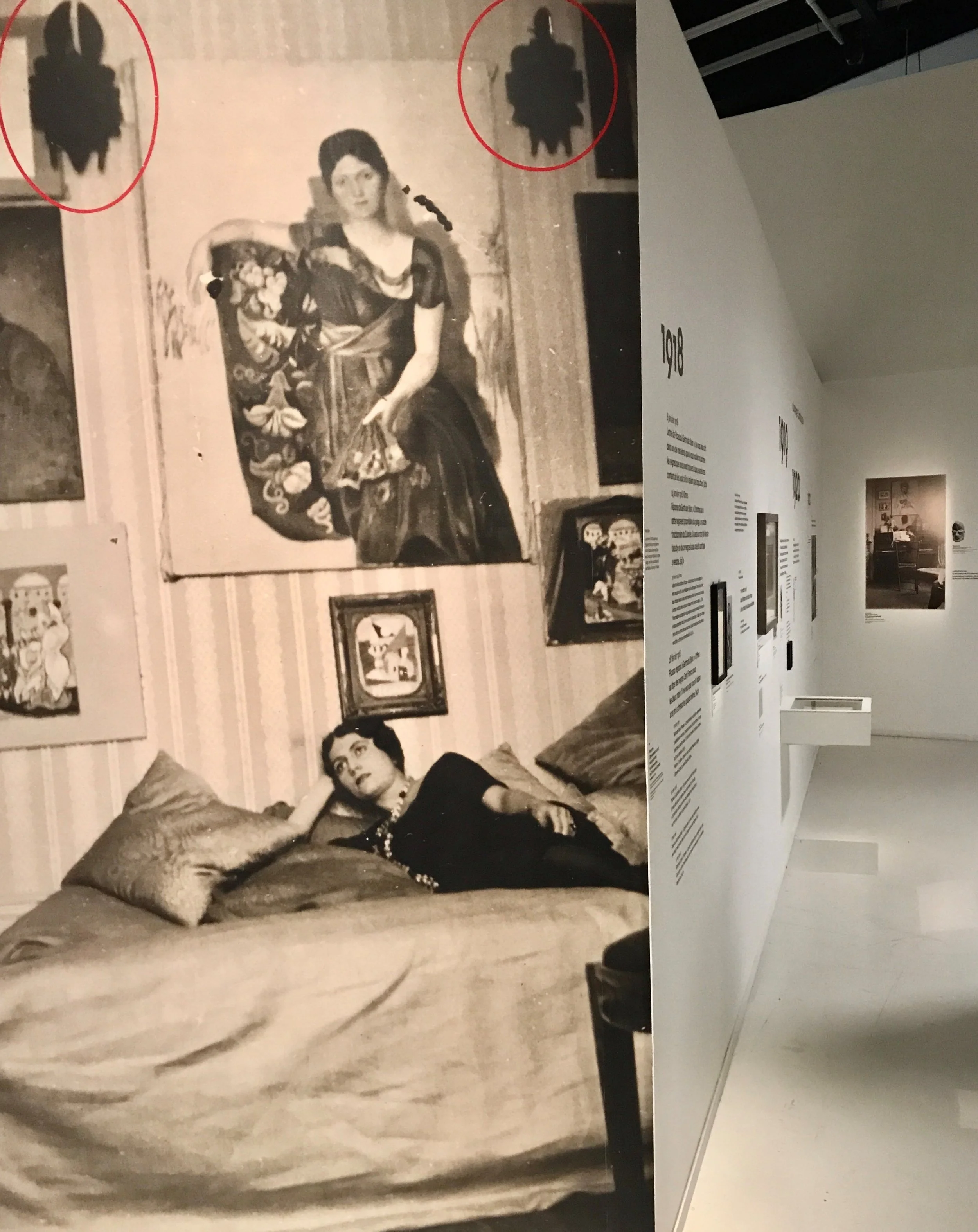 Olga Khokhlova at home. Anonymous photograph blown up in the chronology section of the exhibition.