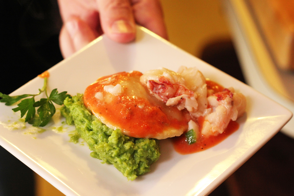 Goats cheese ravioli with pea puree and lobster meat