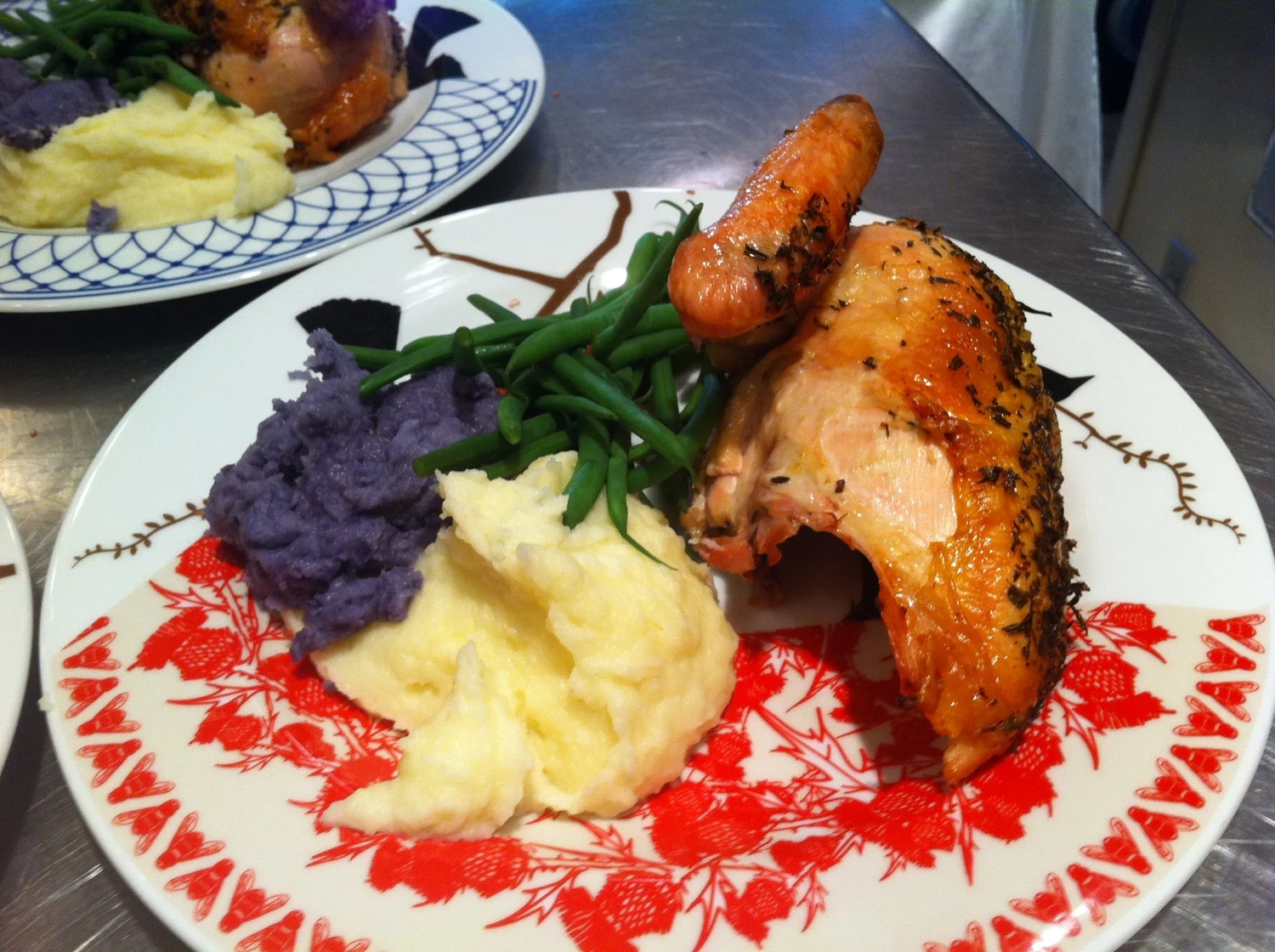 slow roasted Organic chicken with herbs purple and white mash potaotes