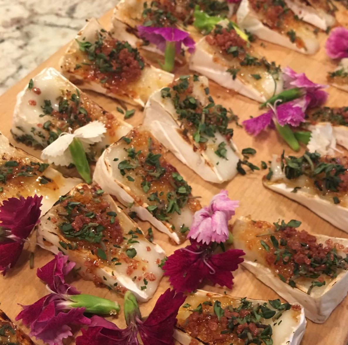 Hard rind goat cheese Brûlée, fresh thyme- red Hawaiian salt