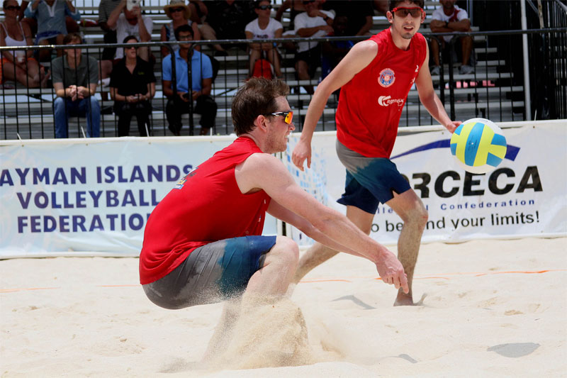 Christian Redmann passes the ball to Felipe Humaña-Paredes in pool play during the NORCECA Grand Cayman tournament Photo: NORCECA