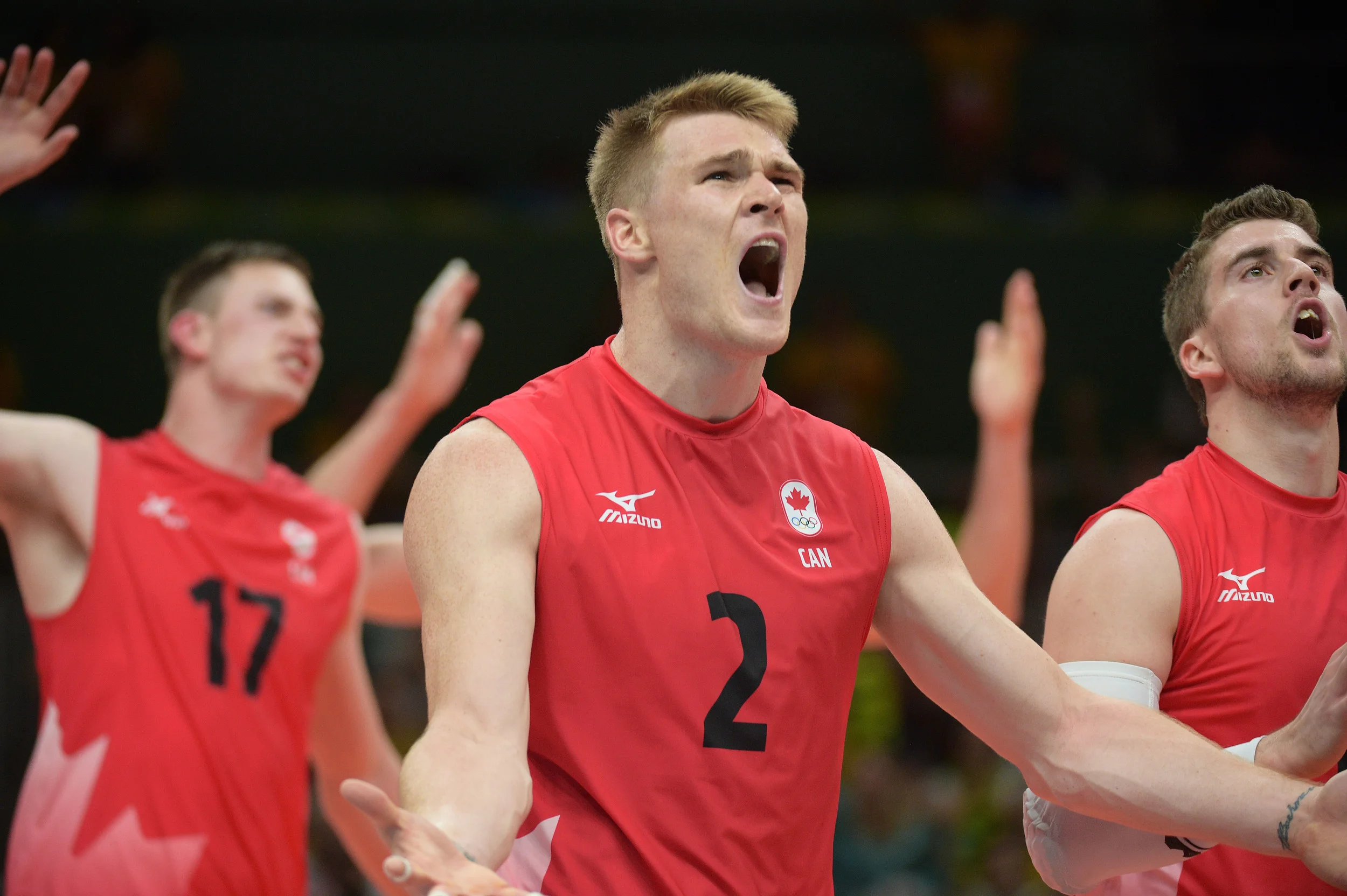 Gord Perrin leads the Canadian players in the questioning of a call &nbsp;Photo: FIVB