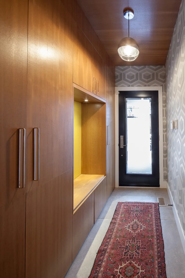 These multi-functional panel units contain storage and seating elements, and are accentuated with specialty lighting. 