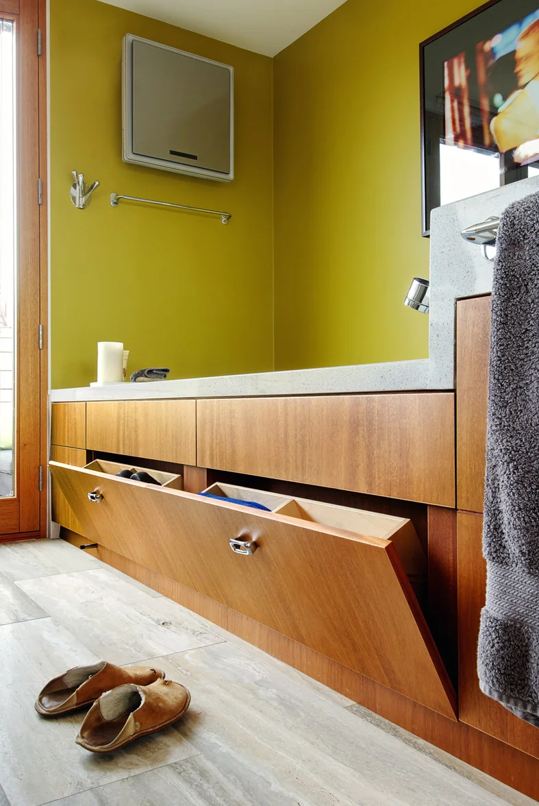 Flipper boxes for shoe storage are one of many ways storage spaces was maximized and cleverly concealed 