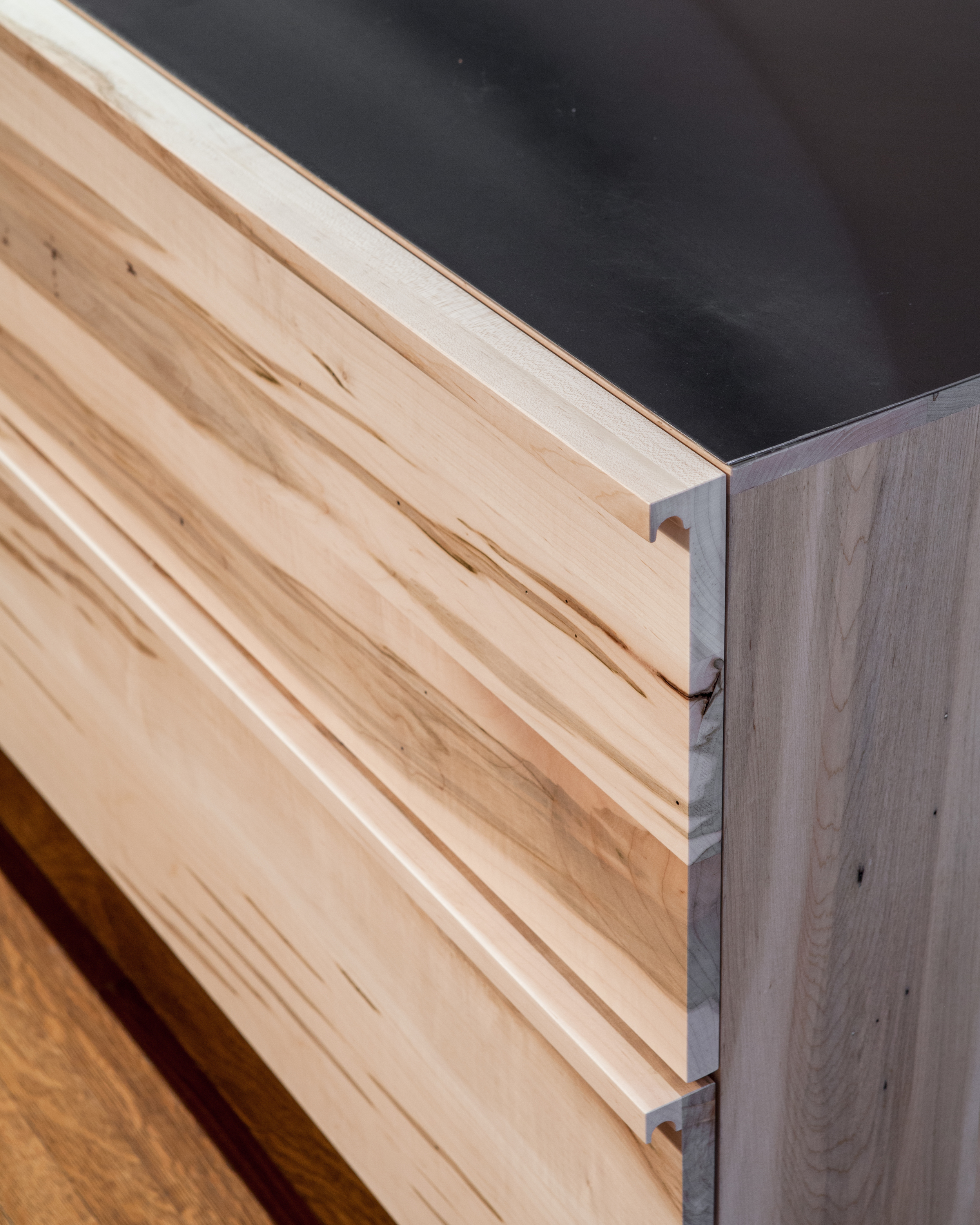 Custom designed pulls in solid maple. Details designed in collaboration with Commute Home.
