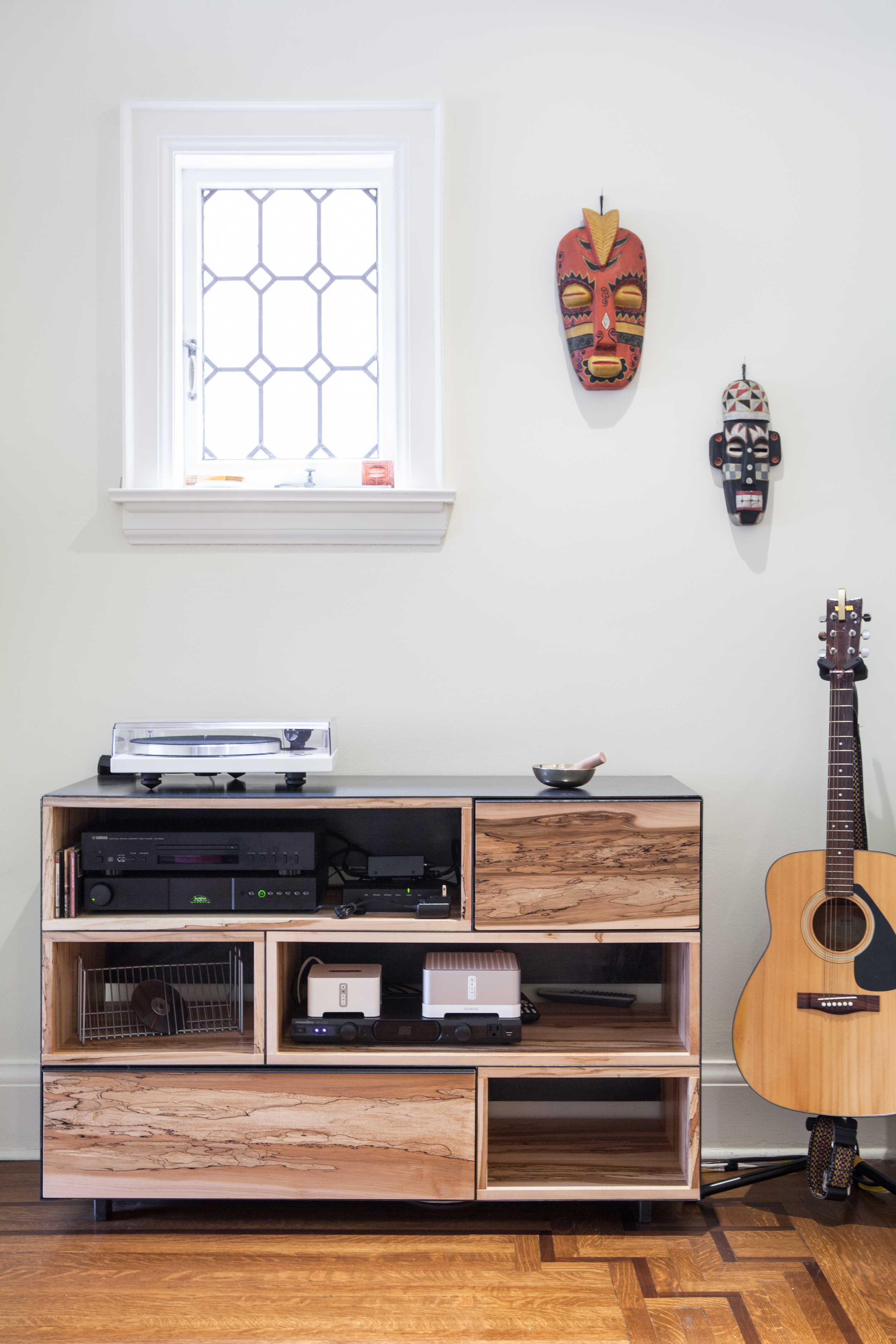 A media unit houses a variety of audio equipment within a composition of open and closed storage that forefronts the bold texture of the spalted maple. Designed in collaboration with Commute Home (fabrication by Commute Home).