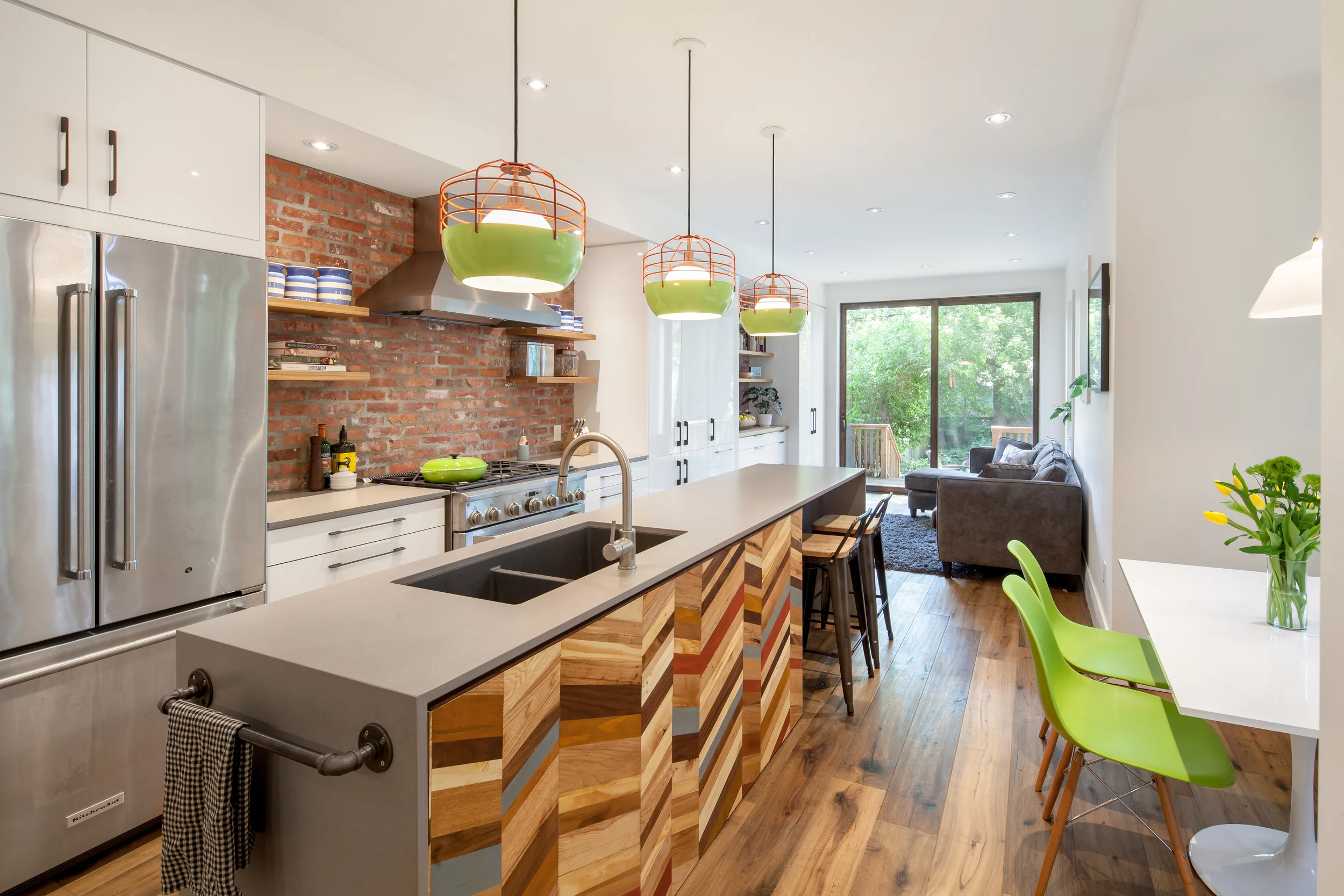 Opening up the back of the house provides a generous, well-lit space for a kitchen and family room, with views out to the back yard. 