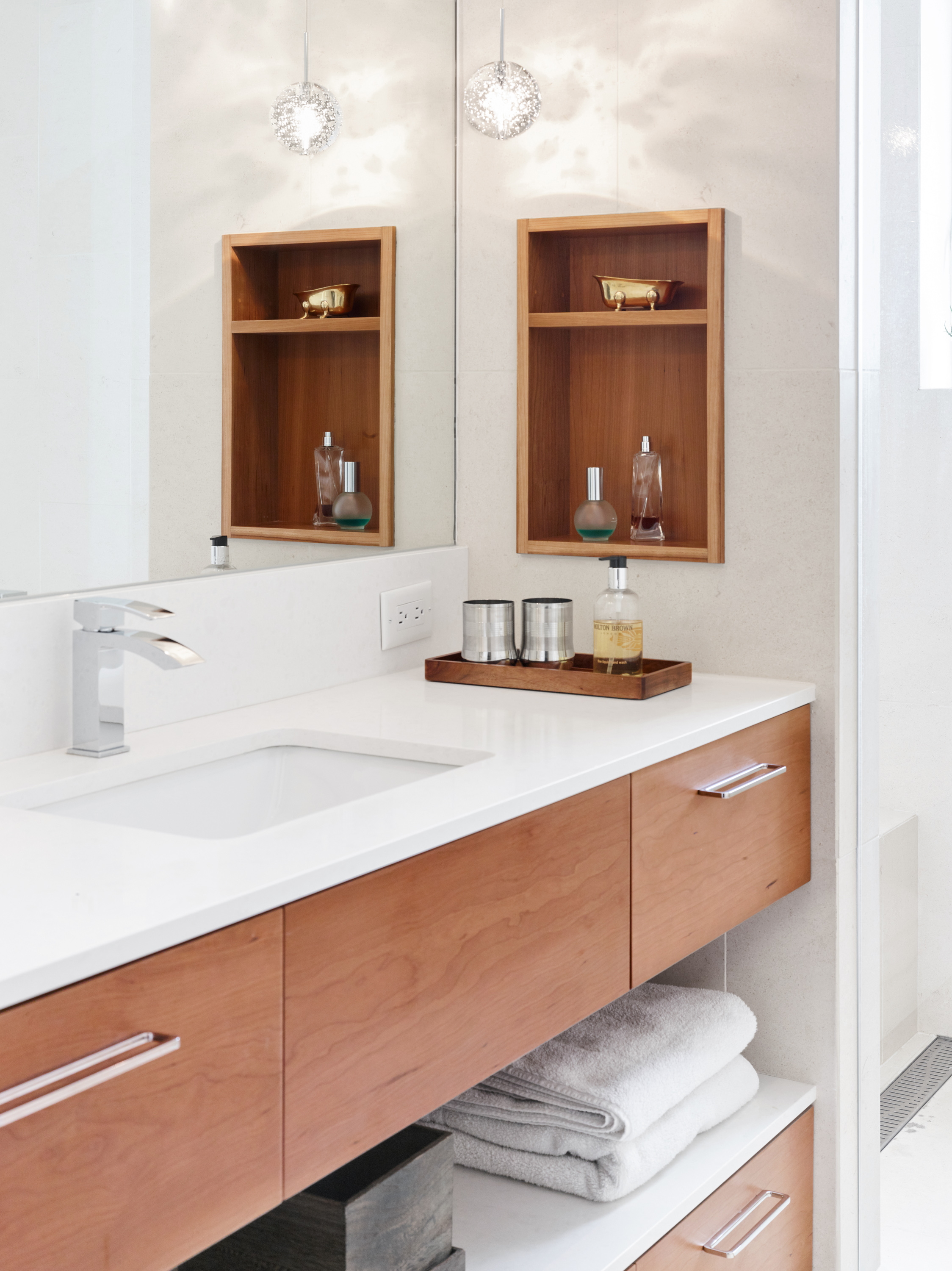 Niche shelving offers even more storage in this elegant retreat.