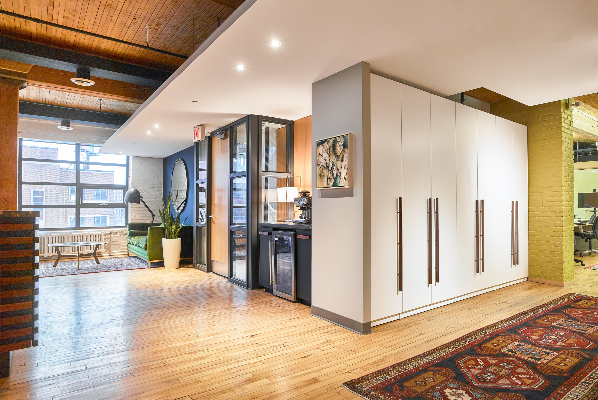 A bank of full height closets are tucked discreetly off the reception area for communal jacket storage.