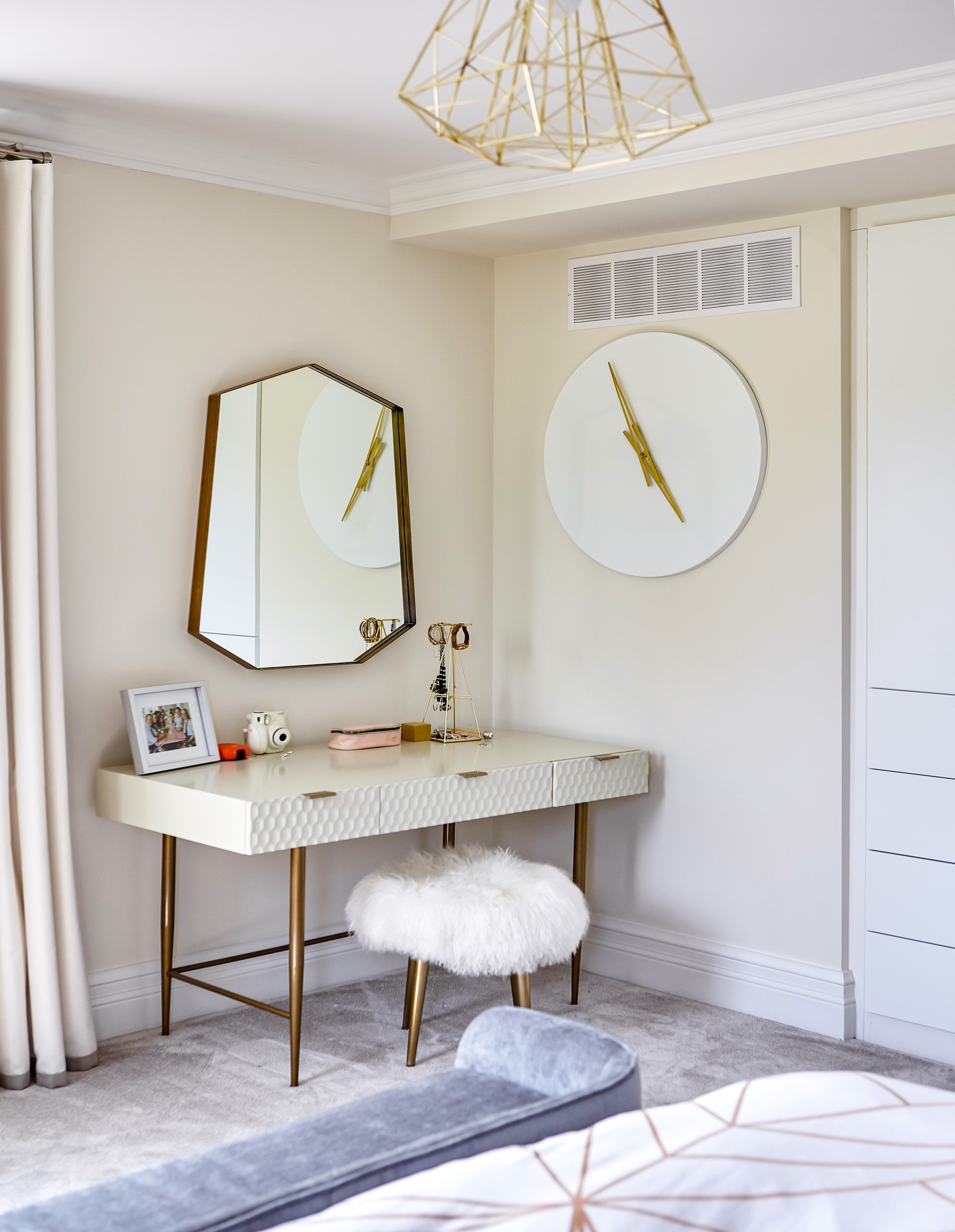 Another bedroom features a different palette of lighter cream tones, soft fabrics, and geometric patterns.
