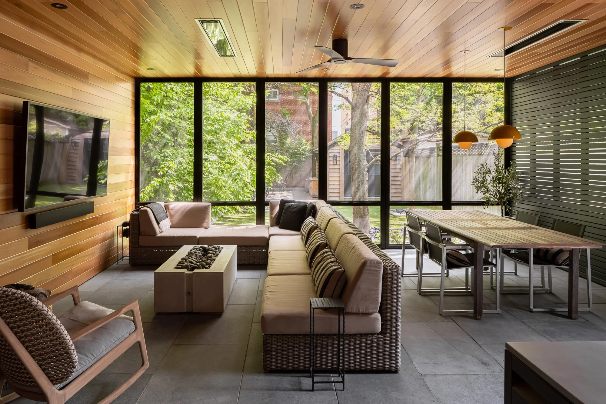 A new gas fire pit was installed in the central seating area, creating a cozy place to lounge all year round. A permanent outdoor tv was installed for watching sports events and movies.